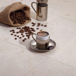 Shell-Beige-16×16-Brushed-Tile-with-Coffee-Closeby